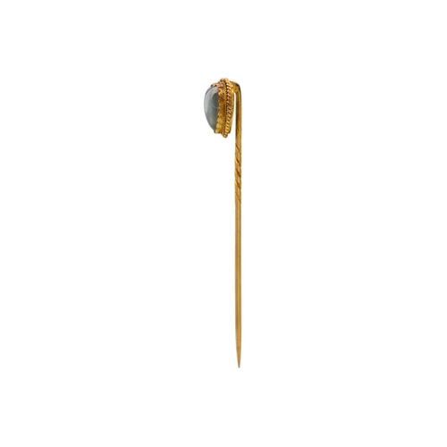 112 - A Victorian heart-shaped moonstone stick pin set in gold. Within fitted case, length 58mm, 1.7g.