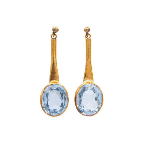 24 - A pair of early 20th century 9ct rose gold blue spinel set drop earrings. The oval cut spinels each ... 