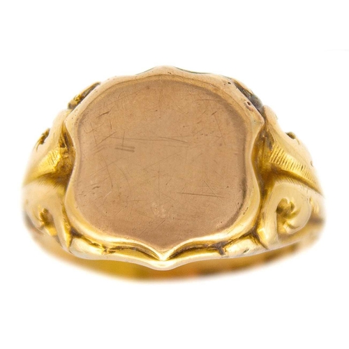 36 - An 18ct hallmarked gold and 9ct shield front gentleman's signet ring. The shield is a replacement an... 