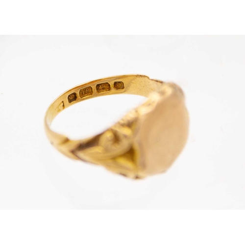 36 - An 18ct hallmarked gold and 9ct shield front gentleman's signet ring. The shield is a replacement an... 