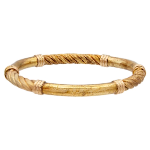 6 - An Italian 9ct hollow gold, rope design, hinged bangle. Inner width 59mm, 10.5g.