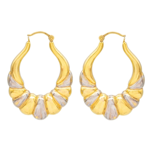 72 - A 9ct yellow and white gold pair of large hollow hoop earrings. Import hallmark for Birmingham 1989,... 