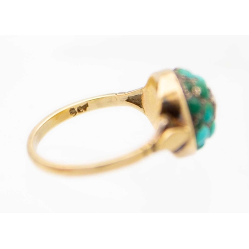 73 - A Victorian 9ct turquoise and diamond pavé set ring. Of domed form and with a central star set small... 