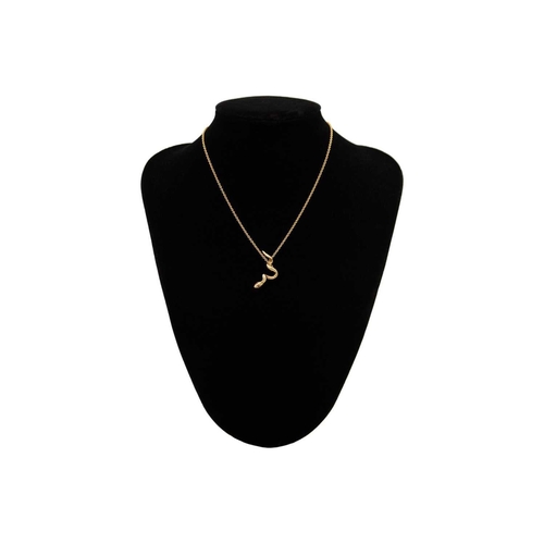 87 - A modern 9ct hallmarked gold serpent pendant on 9ct fine trace necklace. The pendant with ruby set e... 