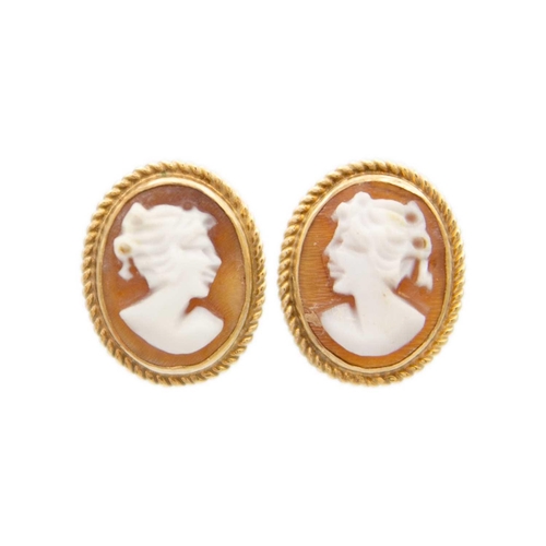 96 - A 9ct shell cameo ring and a pair of 9ct shell cameo earrings. The ring size M, total weight 5.6g.