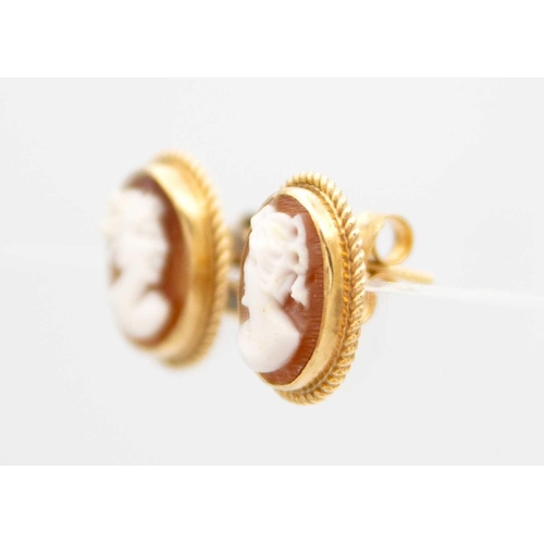 96 - A 9ct shell cameo ring and a pair of 9ct shell cameo earrings. The ring size M, total weight 5.6g.