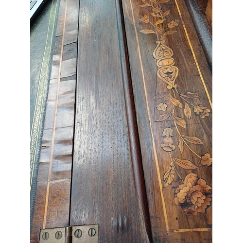 1013 - A Dutch walnut marquetry bureau bookcase. 18th century, the glazed upper part with angled sides and ... 