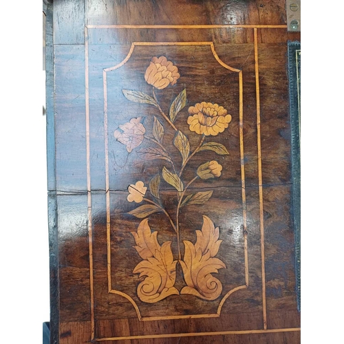 1013 - A Dutch walnut marquetry bureau bookcase. 18th century, the glazed upper part with angled sides and ... 