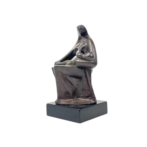 115 - A 20th century bronze model of a mother and baby. Signed monogram mounted on black fibreboard base, ... 