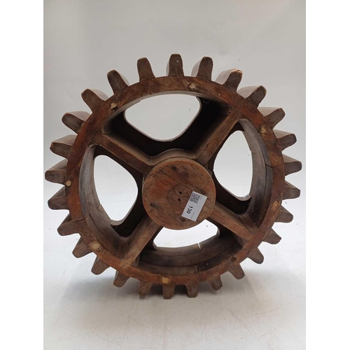 130 - Two hardwood cog patterns One stamped number 404, and the other 7, the larger 38.5cm diameter (2).