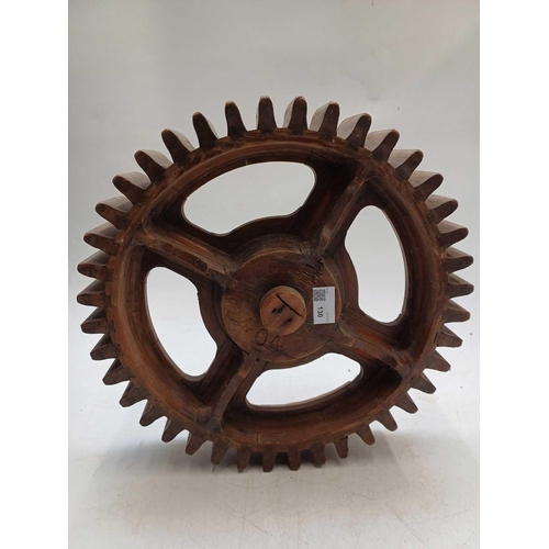 130 - Two hardwood cog patterns One stamped number 404, and the other 7, the larger 38.5cm diameter (2).