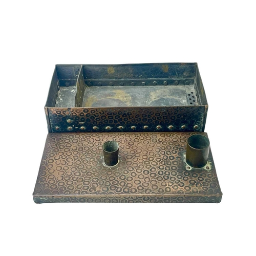 133 - An early 20th century copper warmer/smoker. Decorated with an animal skin design the twin funnel lid... 