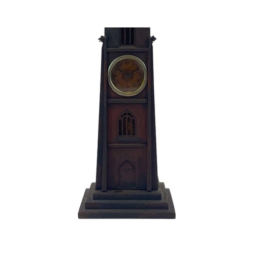 141 - An early 20th century pocket watch stand. Modelled as a gothic revival tower, height 36cm.