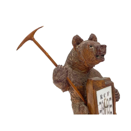 144 - A Black Forest carved bear desk barometer. Inscribed RAGAZ, height 21cm, together with an ebonised c... 