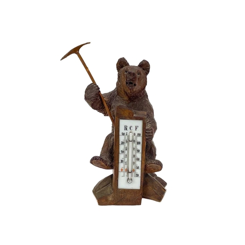 144 - A Black Forest carved bear desk barometer. Inscribed RAGAZ, height 21cm, together with an ebonised c... 