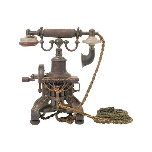 163 - A L M Ericsson & Co skeletal telephone. Height 30cm. The winding crank turns but with some friction,... 