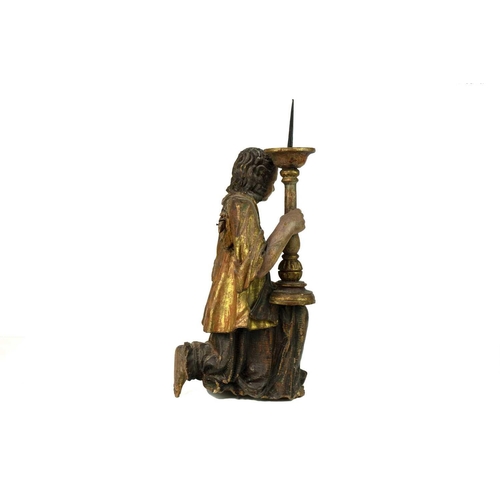 170 - A painted and gilt altar pricket candlestick. 17th/18th century, probably Italian, carved as a kneel... 