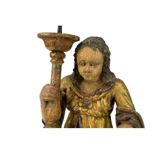 170 - A painted and gilt altar pricket candlestick. 17th/18th century, probably Italian, carved as a kneel... 