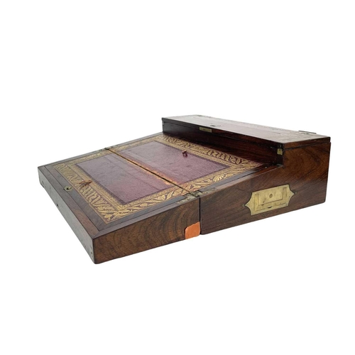 178 - A Regency rosewood lap desk or writing box. With fret cut brass banding and inlay, the eagle topped ... 