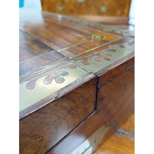 178 - A Regency rosewood lap desk or writing box. With fret cut brass banding and inlay, the eagle topped ... 