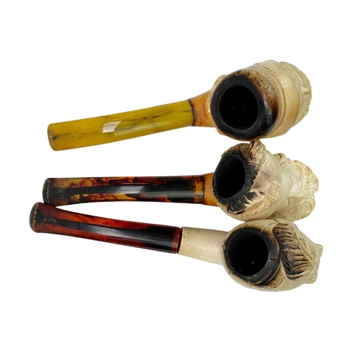 181 - A Turkish meerschaum pipe in a fitted case. Together with three other meerschaum pipes. (4)