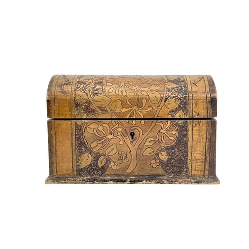 182 - An Arts and Crafts dome top pokerwork stationary box. With an inscribed motto and incised honeysuckl... 