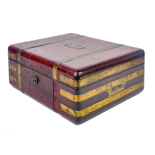 183 - A good William IV mahogany and brass bound campaign dressing case. The inside lid with a descriptive... 