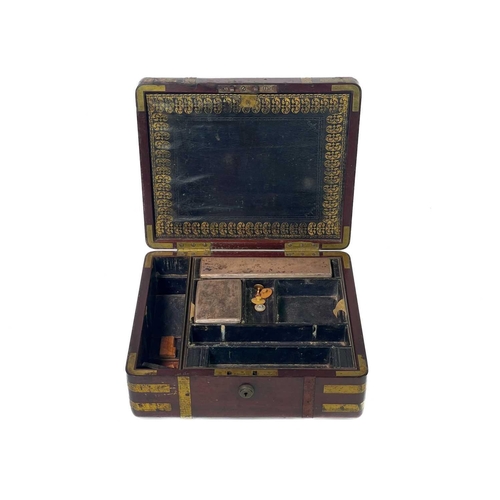 183 - A good William IV mahogany and brass bound campaign dressing case. The inside lid with a descriptive... 