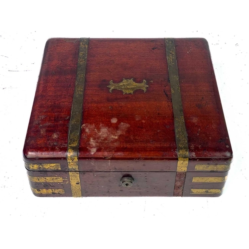 183 - A good William IV mahogany and brass bound campaign dressing case. The inside lid with a descriptive... 