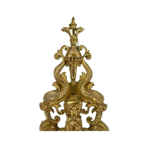 186 - A pair of French brass chenets, In Louis XVI style height 45cm.