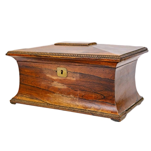 193 - A William IV rosewood tea caddy. Of swept sarcophagus form, with two internal compartments and a rec... 