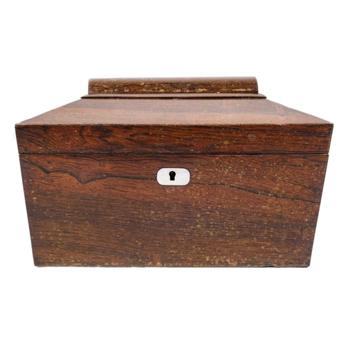 193 - A William IV rosewood tea caddy. Of swept sarcophagus form, with two internal compartments and a rec... 