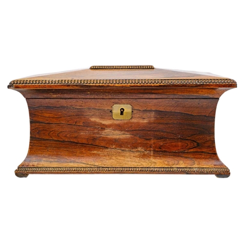 193 - A William IV rosewood tea caddy. Of swept sarcophagus form, with two internal compartments and a rec... 