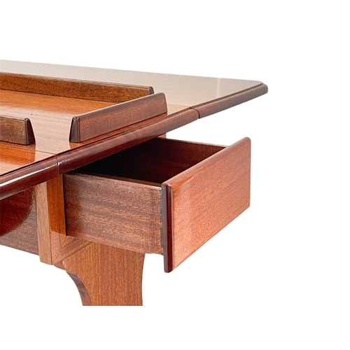 242 - A varnished teak twin flap table from a yacht. The inlaid top with removable gallery, and fitted a d... 