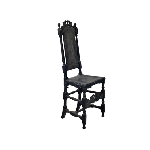 245 - A Charles II oak side chair. With carved cresting rail, turned uprights, and studded leather back an... 