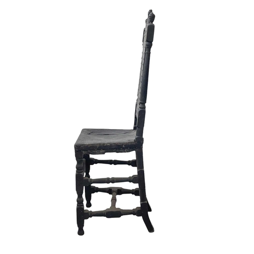 245 - A Charles II oak side chair. With carved cresting rail, turned uprights, and studded leather back an... 