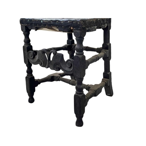 245 - A Charles II oak side chair. With carved cresting rail, turned uprights, and studded leather back an... 