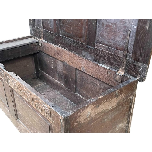 250 - An oak panel coffer. Early 18th century, with two fielded panels below an arcaded frieze, on stile f... 