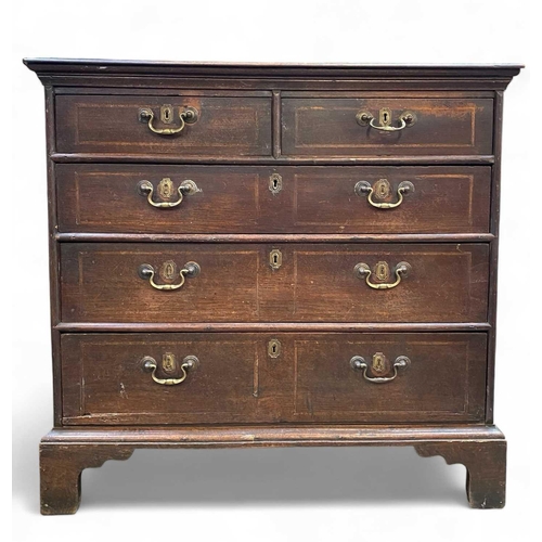 254 - An 18th century oak chest of drawers. With two short and three long drawers raised on bracket feet, ... 