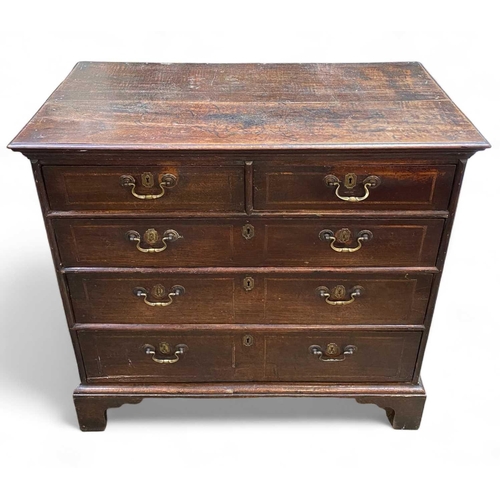 254 - An 18th century oak chest of drawers. With two short and three long drawers raised on bracket feet, ... 