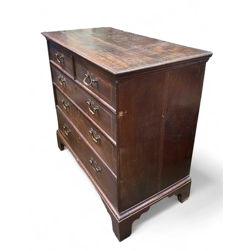 254 - An 18th century oak chest of drawers. With two short and three long drawers raised on bracket feet, ... 