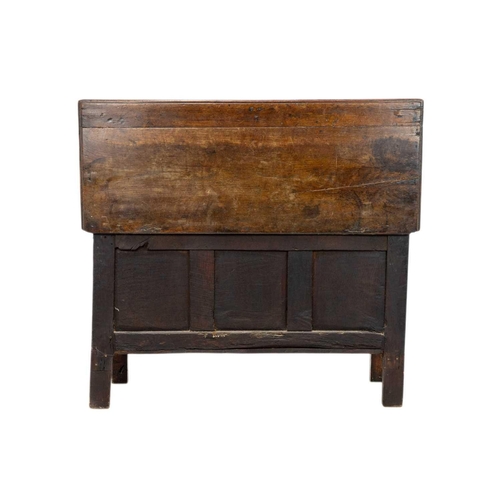 266 - An oak panel coffer. 18th century, with triple carved panel front, on stile feet, height 69cm, width... 