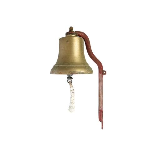 269 - A bronze bell. Mounted on an iron wall bracket, bell diameter 24,5cm.