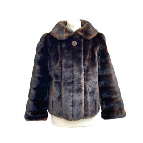 278 - A short faux fur jacket. Chest 36