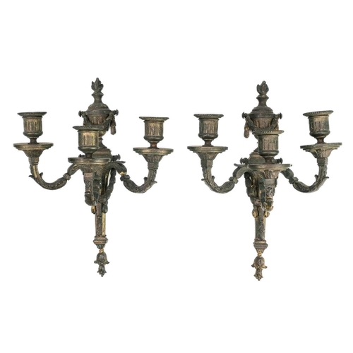 286 - A pair of gilt bronze triple branch wall appliques. Louis XVI style, height 30cm.