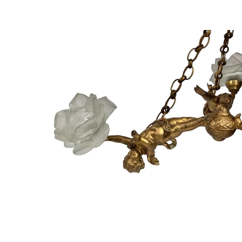 291 - A gilt metal hanging electrolier. Early 20th century, with three winged cherubs each supporting a pe... 