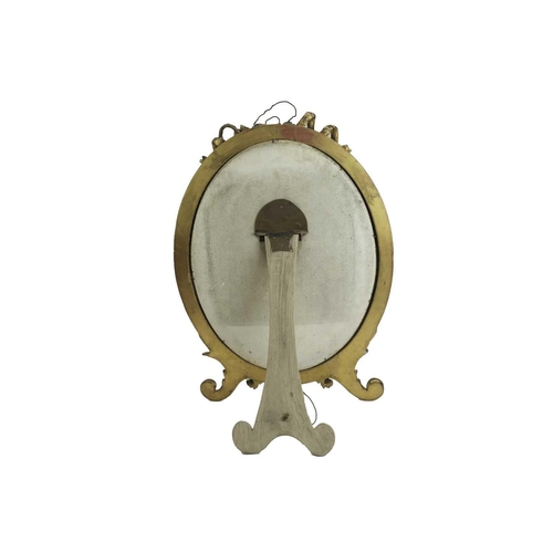 292 - A 19th century gilt gesso oval table mirror. Height 61cm.