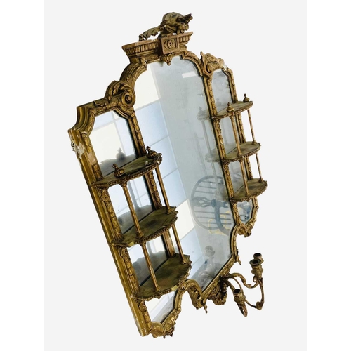 308 - A late Victorian gilt gesso girandole wall mirror. The central plate flanked by shaped shelves, with... 