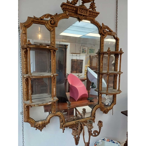 308 - A late Victorian gilt gesso girandole wall mirror. The central plate flanked by shaped shelves, with... 