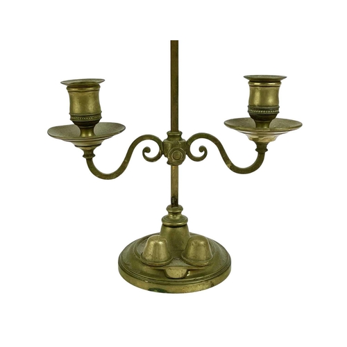 309 - A pair of Victorian brass twin-branch adjustable candle lamps by Miller & Sons. With adjustable shad... 